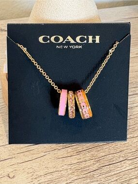 Coach Gold-Tone Rondel Necklace with Pink Enamel & Crystal Ring Charms